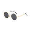 Round sunglasses with gold frame and black lenses on a white background