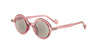 Round pink sunglasses with translucent pink frames and gray lenses, shown on a clean white background.