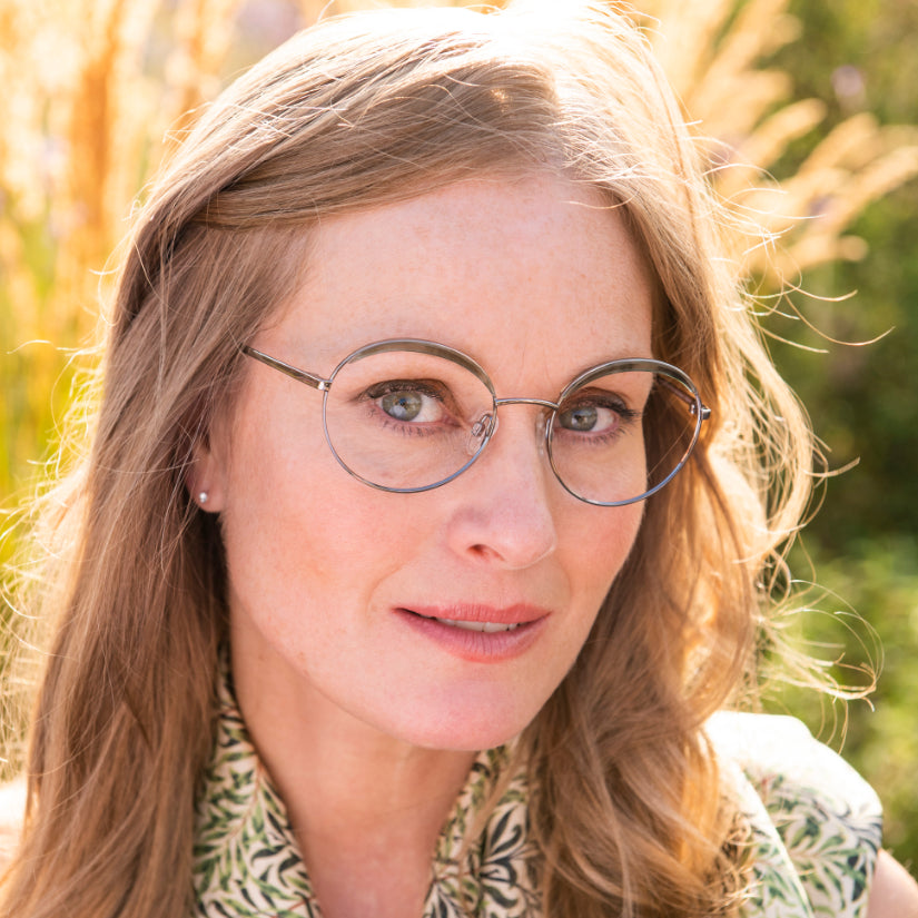 Sarah wears Willow Bough frames in green from the William Morris Gallery Collection